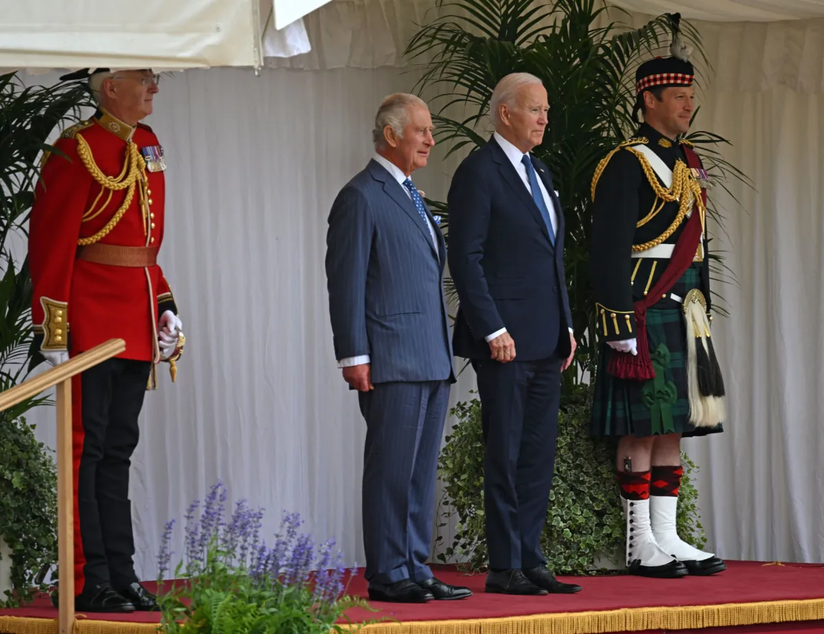 President Joe Biden (2R) and Britain's King Charles III (2L) on the dais, during a ceremonial welcome in the Quadrangle at Windsor Castle in Windsor on July 10, 2023. (Andrew Caballero-Reynolds/AFP via Getty Images)