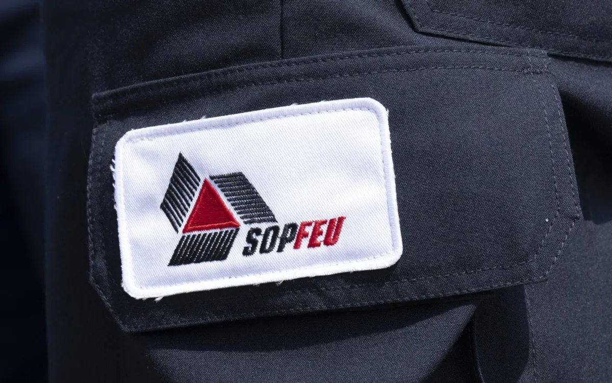 A SOPFEU patch is seen on a worker's leg near Lebel-sur-Quevillon, Que., July 5, 2023. (The Canadian Press/Adrian Wyld)
