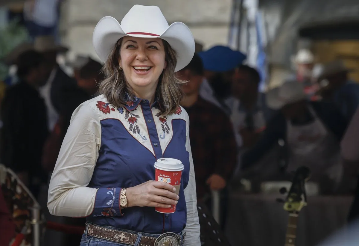 Alberta Premier Danielle Smith attends her Stampede pancake breakfast in Calgary, Alta., July 10, 2023. (The Canadian Press/Jeff McIntosh)