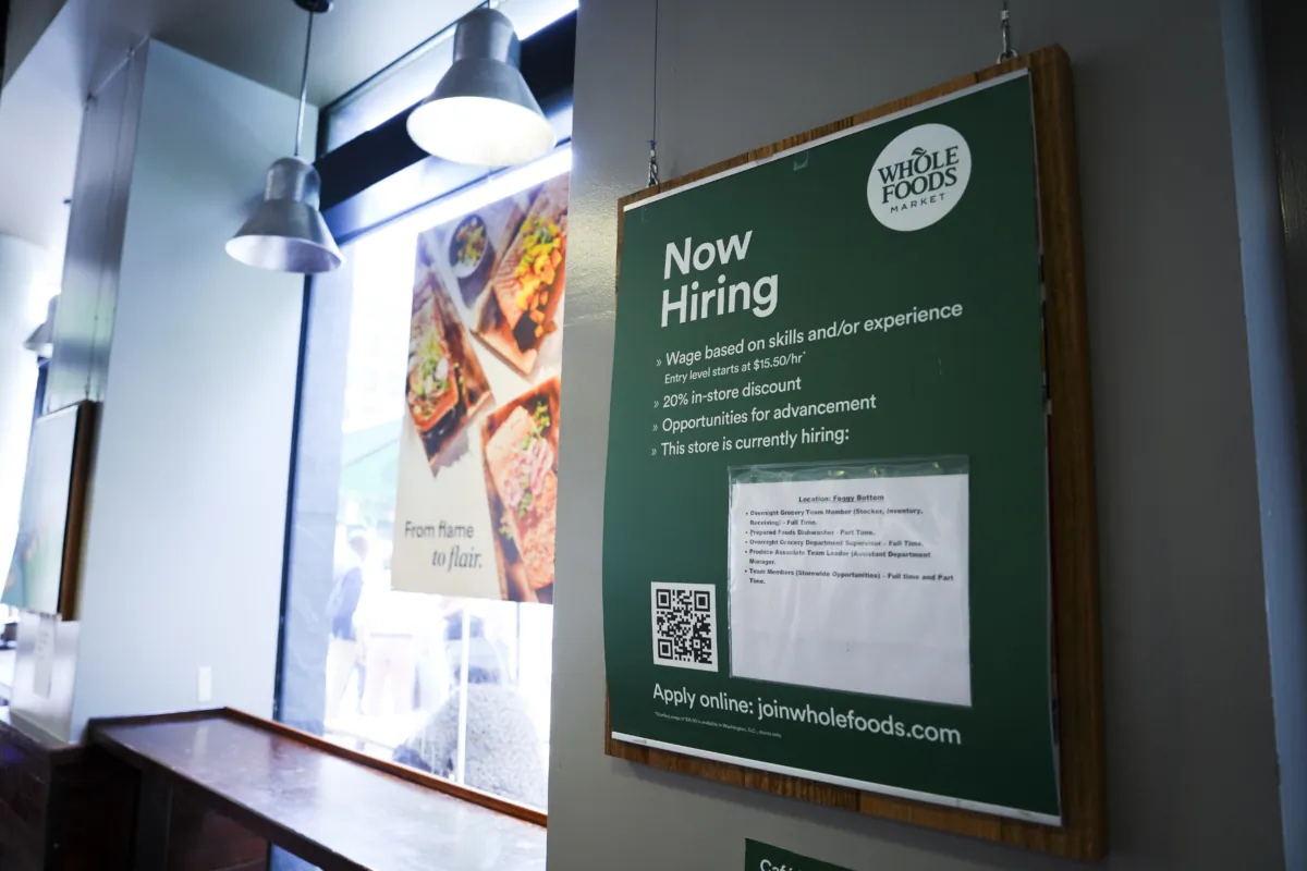 “Now Hiring” sign displayed at a grocery store in Washington on July 10, 2023. (Madalina Vasiliu/The Epoch Times)