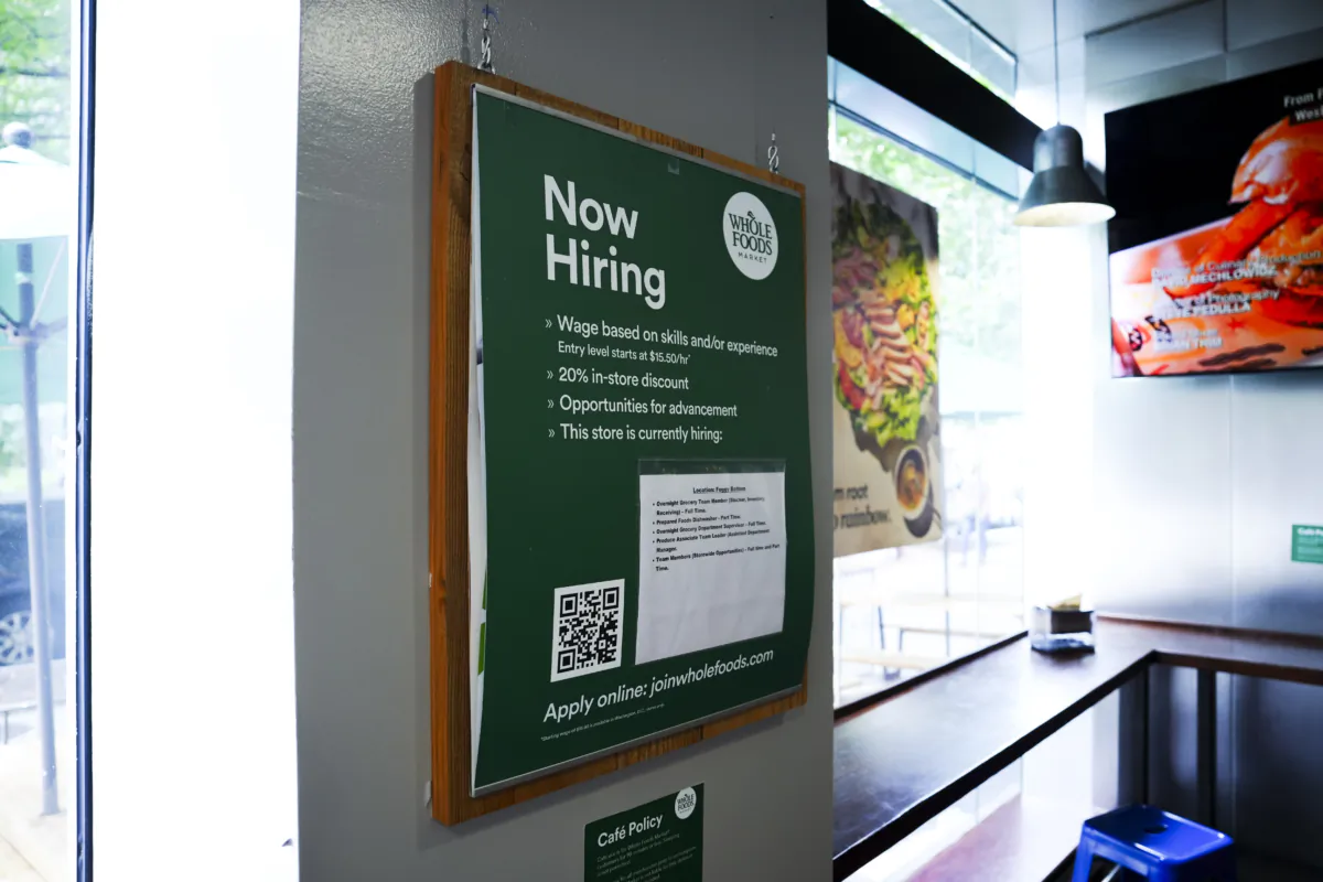 A hiring sign displayed at a grocery store in Washington on July 10, 2023. (Madalina Vasiliu/The Epoch Times)