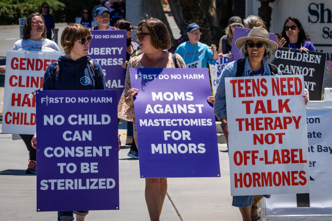 DeTransition advocates protest outside of the annual Pediatric Endocrine Society conference held in San Diego, Calif., on May 6, 2023. (John Fredicks/The Epoch Times)