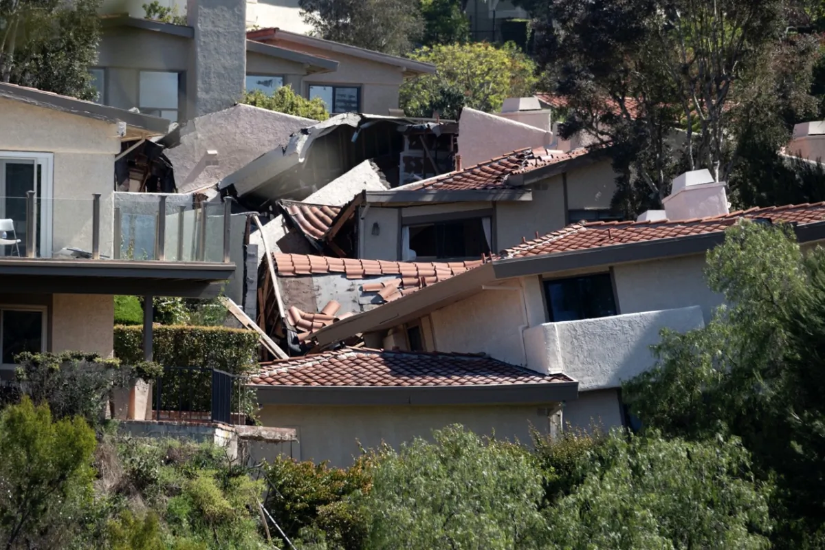 Damaged homes are torn apart by earth movement in the Los Angeles County city of Rolling Hills Estates, Calif., on July 10, 2023. (Richard Vogel/AP Photo)