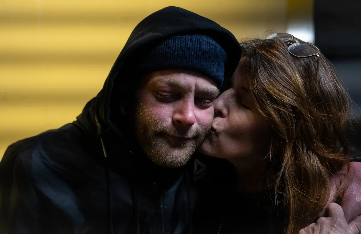Jacqui Berlinn embraces her son Corey who is homeless and addicted to fentanyl, in San Francisco, Calif., on Feb. 22, 2023. (John Fredricks/The Epoch Times)