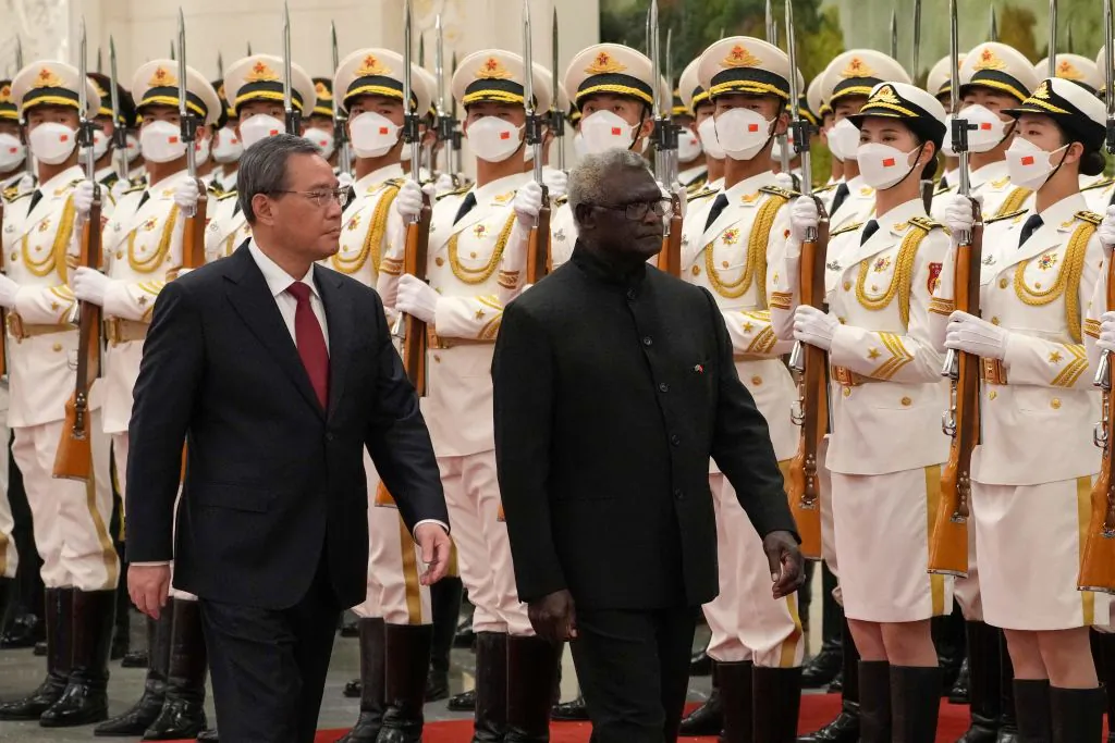Solomon Islands' Prime Minister Manasseh Sogavare (R) and China's Premier Li Qiang inspect the guard of honour during a welcome ceremony at the Great Hall of the People in Beijing, China on July 10, 2023. (Andy Wong/POOL/AFP via Getty Images)