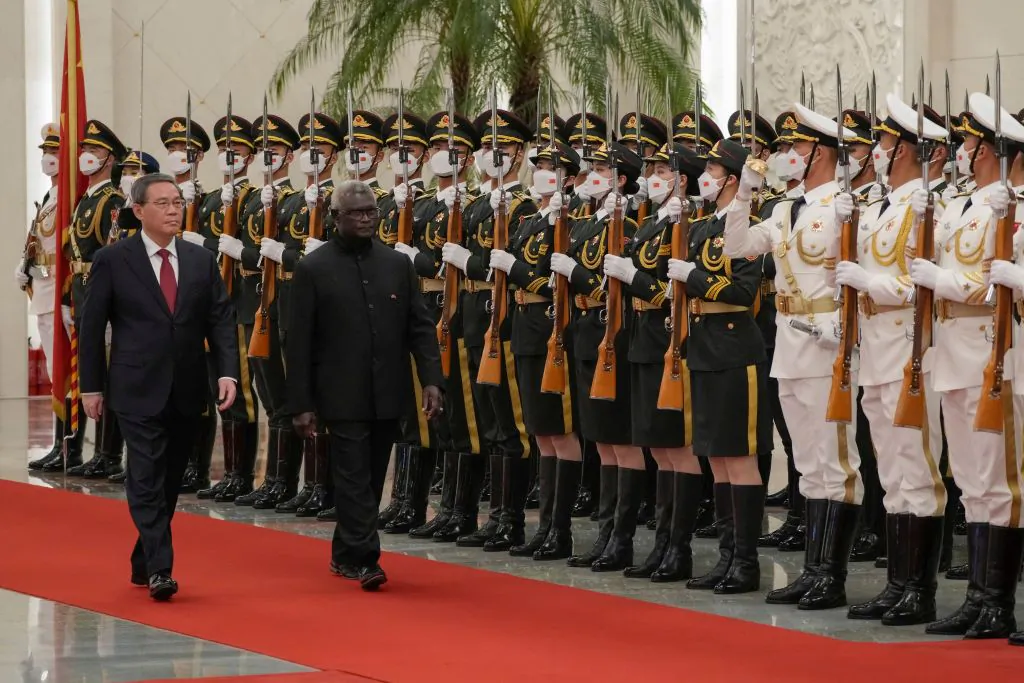 Solomon Islands' Prime Minister Manasseh Sogavare (R) and China's Premier Li Qiang inspect the guard of honour during a welcome ceremony at the Great Hall of the People in Beijing, China on July 10, 2023. (Andy Wong/POOL/AFP via Getty Images)