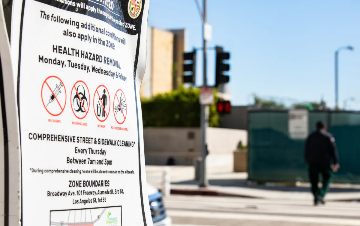 A sign prohibiting drug use and camping sits off a sidewalk in Los Angeles on Jan. 27, 2023. (John Fredricks/The Epoch Times)