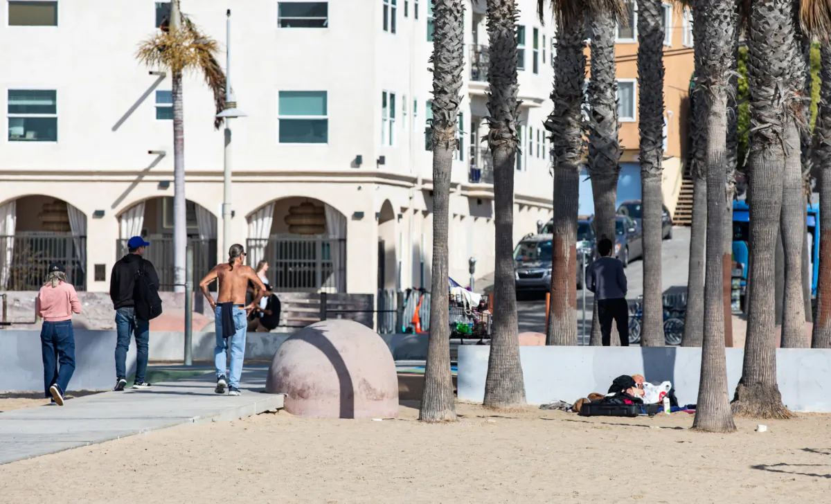 A homeless person rests during the day in Santa Monica, Calif., on Jan. 19, 2023. (John Fredricks/The Epoch Times)