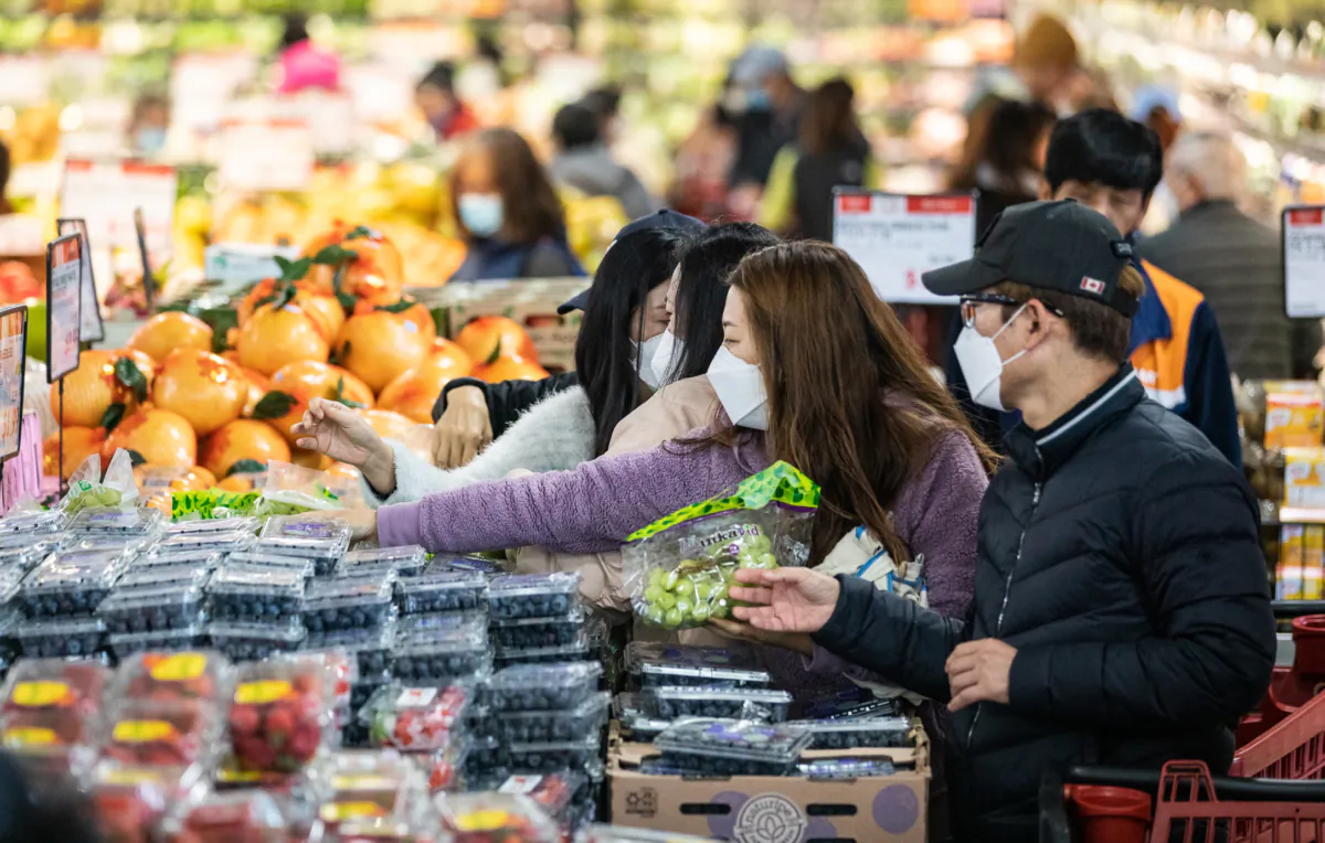 Irvine residents celebrate the grand opening of H Mart in Irvine, Calif., on Jan. 11, 2023. (John Fredricks/The Epoch Times)