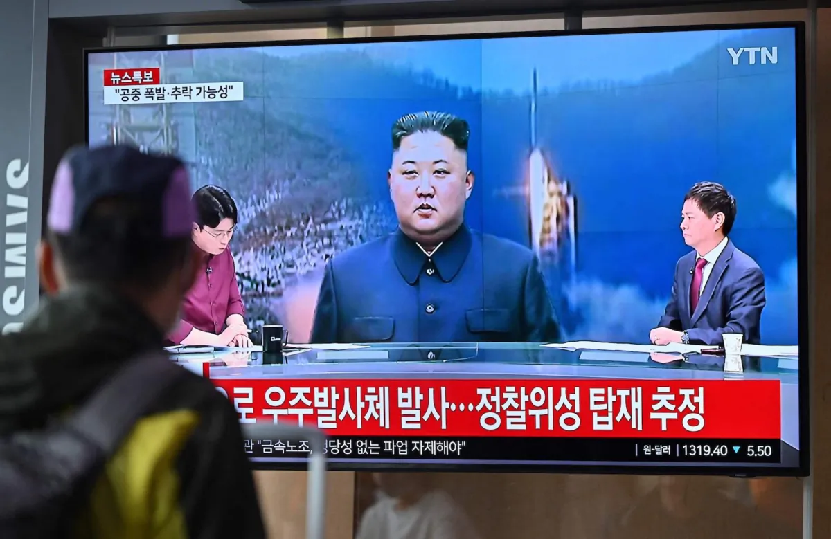 A man watches a television screen showing a news broadcast with file footage of North Korea's leader Kim Jong Un, at the Seoul Railway Station in Seoul on May 31, 2023. (Jung Yeon Je/AFP via Getty Images)
