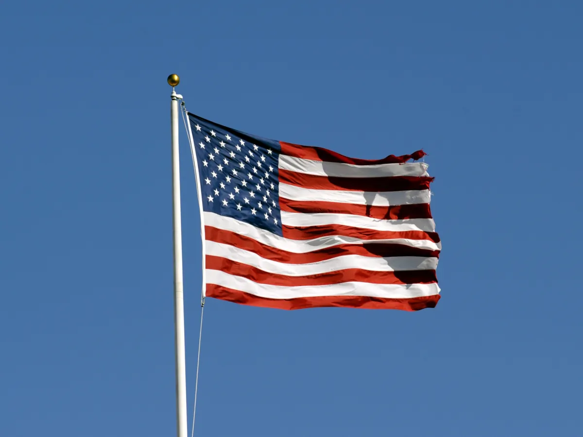 The American flag flies in a stiff breeze during pre-game ceremonies as the Tampa Bay Buccaneers host the Atlanta Falcons at the Raymond James Stadium in Tampa, Fla., on Dec. 16, 2007. (Al Messerschmidt/Getty Images)