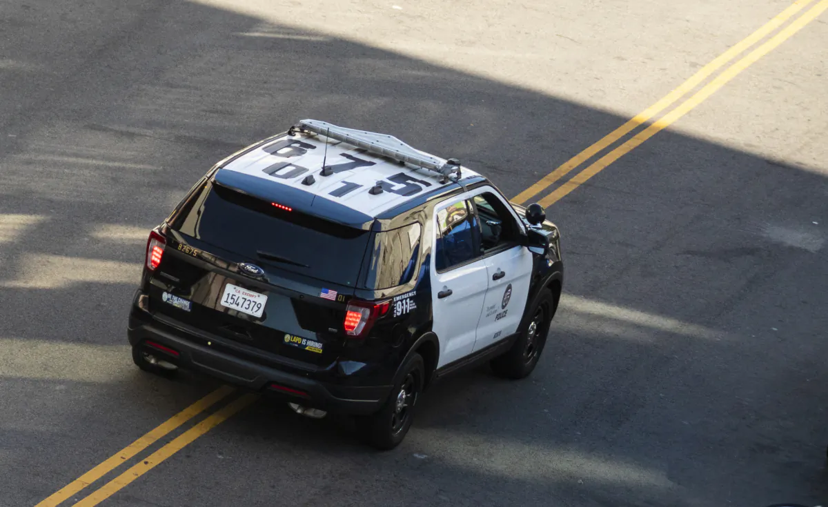 An Los Angeles Police Department car patrols downtown Los Angeles on Jan 6, 2022. (John Fredricks/The Epoch Times)