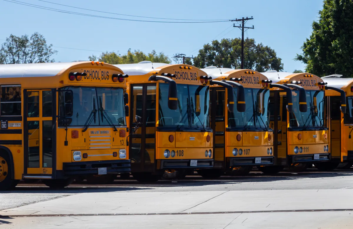 School busses parked near Newport Mesa Unified School District in Costa Mesa, Calif., on Sept. 21, 2022. (John Fredricks/The Epoch Times)