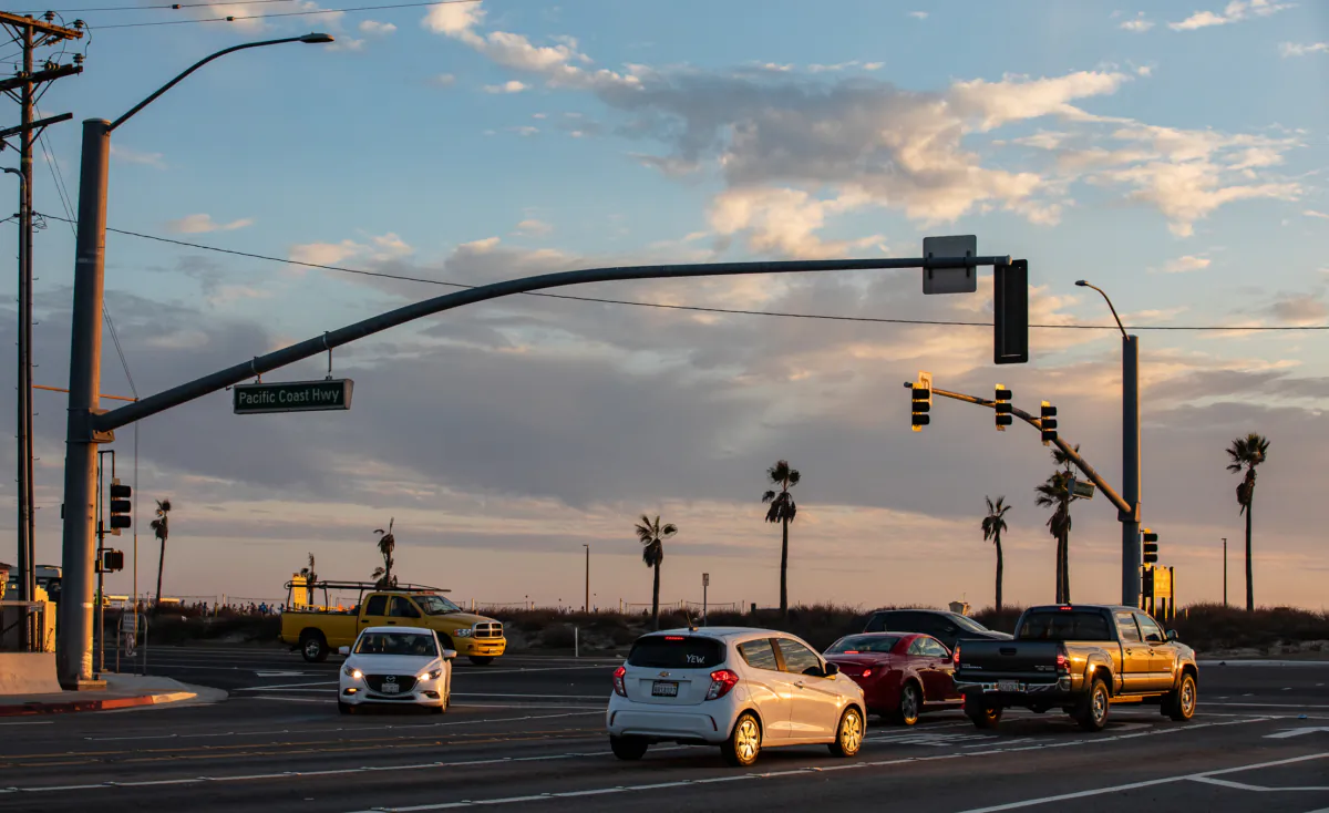 Cars drive along PCH in Huntington Beach, Calif., on Nov. 12, 2020. (John Fredricks/The Epoch Times)