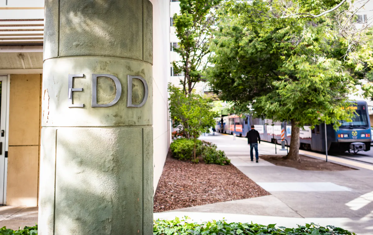 People walk past the California Employment Development Department (EDD) in Sacramento, Calif., on April 18, 2022. (John Fredricks/The Epoch Times)