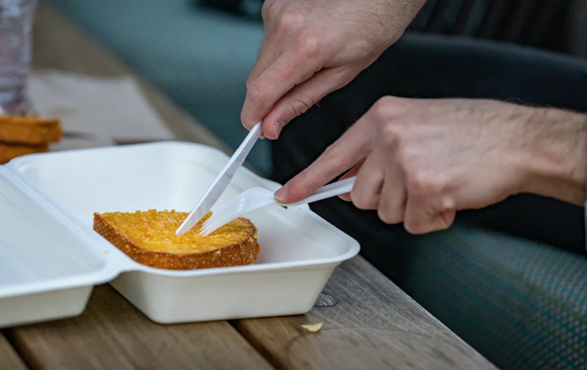 A man uses plastic utensils in Southern California on April 12, 2022. (John Fredricks/The Epoch Times)
