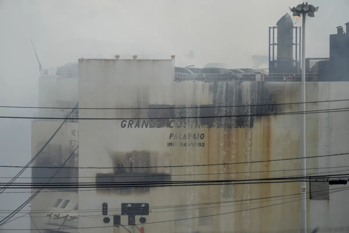 Emergency personnel battle against a fire aboard the Italian-flagged Grande Costa d'Avorio cargo ship at the Port of Newark in Newark, N.J., on July 7, 2023. (John Minchillo/AP Photo)
