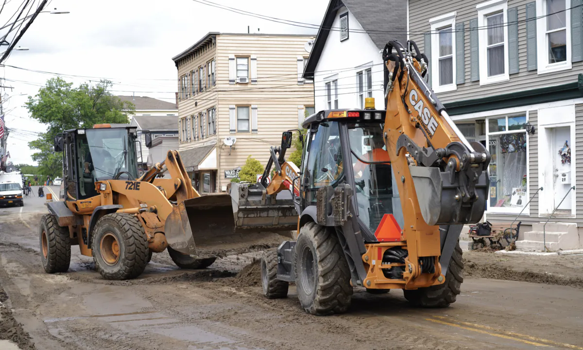 Village trucks cleaned up mud on Main Street the day after a historic flood in Highland Falls, N.Y., on July 10, 2023. (Cara Ding/The Epoch Times)