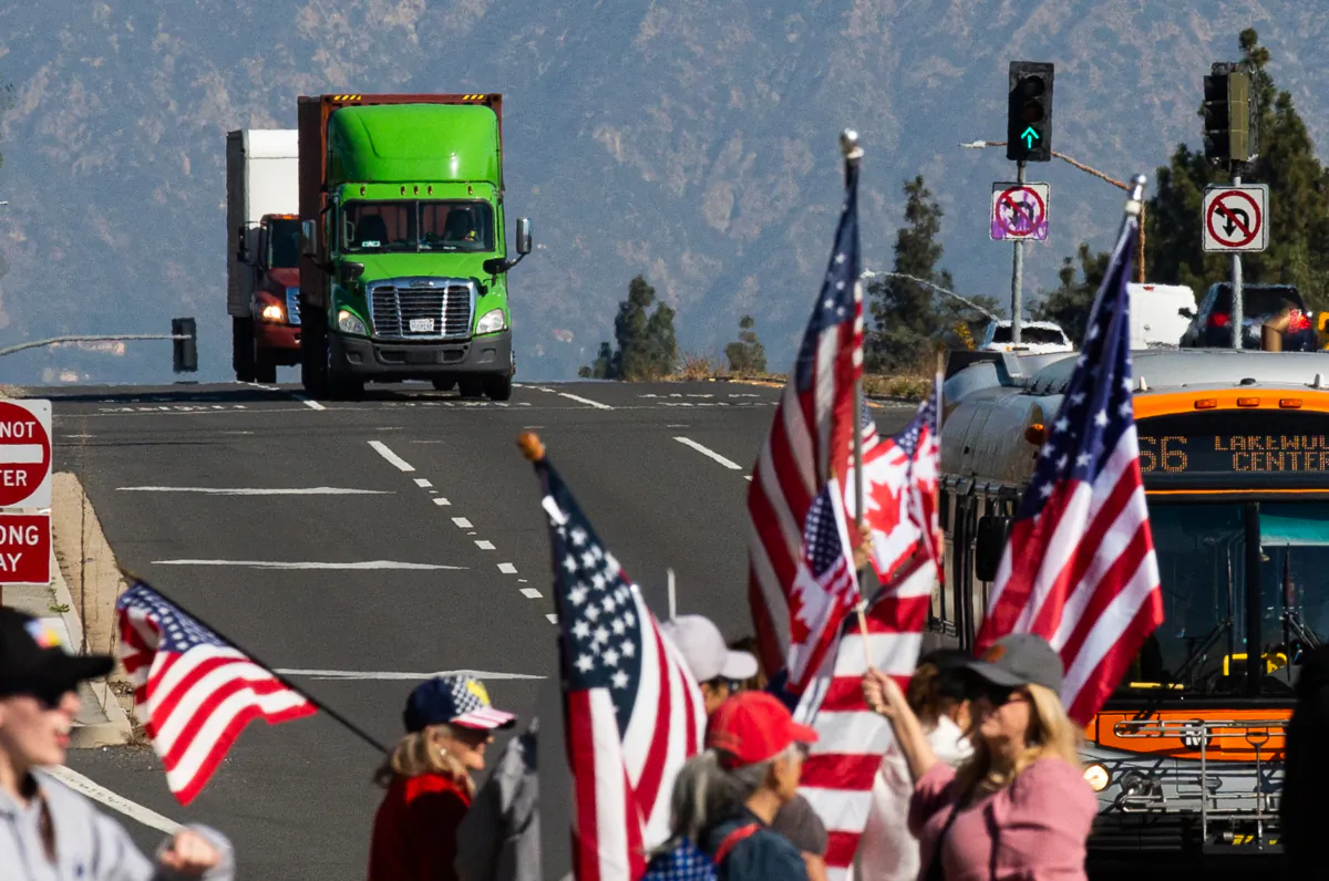 People gather in El Monte, Calif., to show support for truckers partaking in a convoy from Los Angeles to Washington D.C in protest of coronavirus mandates on Feb. 25, 2022. (John Fredricks/The Epoch Times)