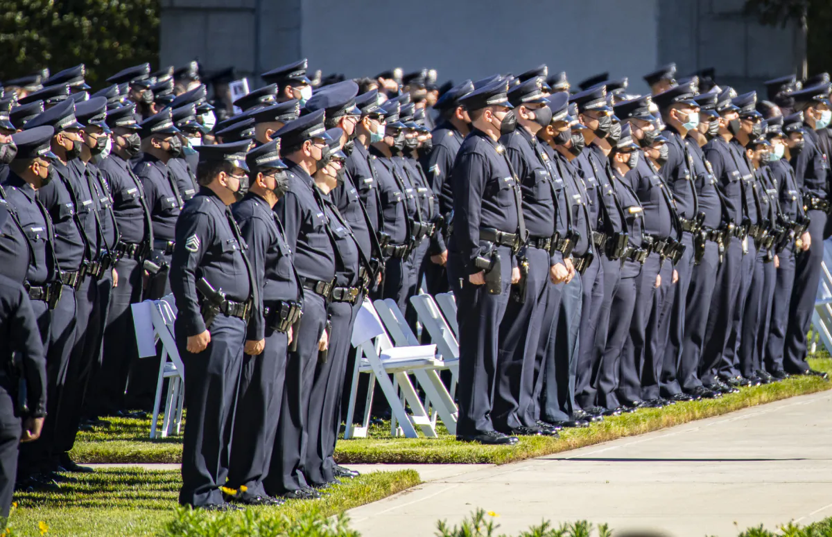 LAPD and Los Angeles Sheriff's Department officers pay respects at the memorial service of LAPD Officer Fernando Arroyos in Los Angeles, Calif., on Feb. 2, 2022. (John Fredricks/The Epoch Times)