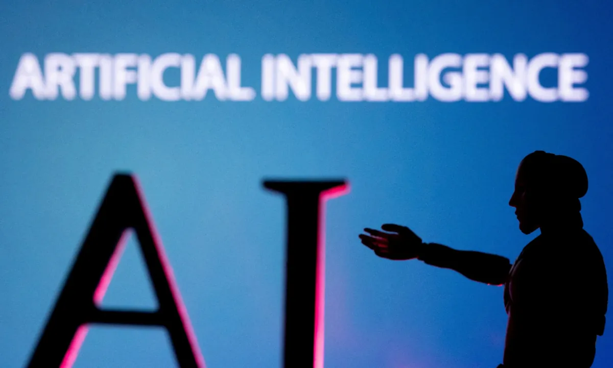 AI (artificial Intelligence) letters and a robot miniature are seen in an illustration image, on June 23, 2023. (Dado Ruvic/Reuters)
