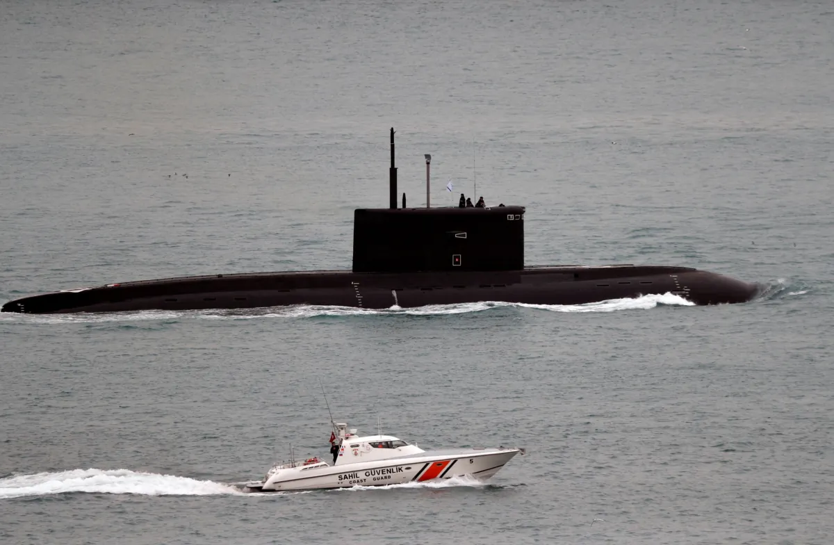 A Turkish Coast Guard boat escorts Russian Kilo-class diesel-electric submarine Krasnodar as it sails in the Bosphorus, on its way to the Mediterranean Sea, in Istanbul on March 14, 2019. (Murad Sezer/Reuters)