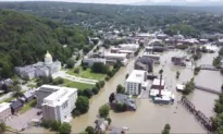 Flooded New England Communities Shift to Recovery, Shoveling out Tons of Mud and Debris