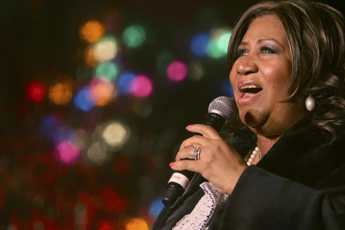 Aretha Franklin performs during the 85th annual Christmas tree lighting at the New York Stock Exchange in New York on Dec. 4, 2008. (Mary Altaffer/AP Photo)