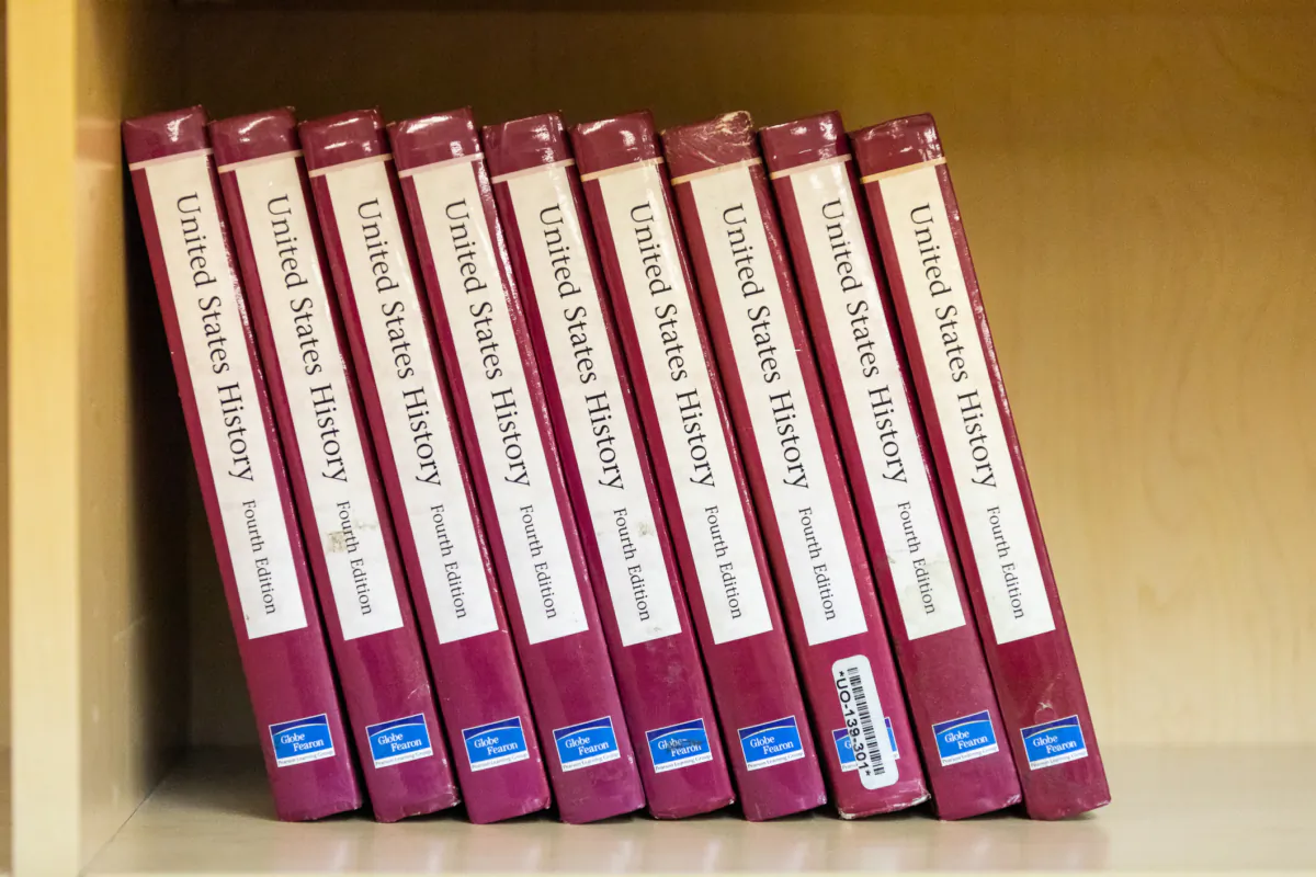 Books on a shelf at the Orange County Classical Academy in Orange, Calif., on March 10, 2021. (John Fredricks/The Epoch Times)