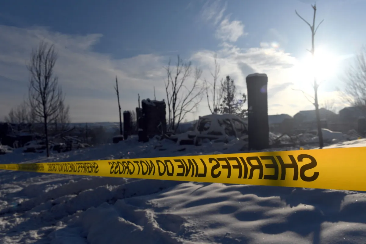 Police tape closes off access to a home destroyed by the Marshall Fire in the Rock Creek neighborhood in the town of Superior in Boulder County, Colo., on Jan. 1, 2022. (Jason Connolly/AFP via Getty Images)