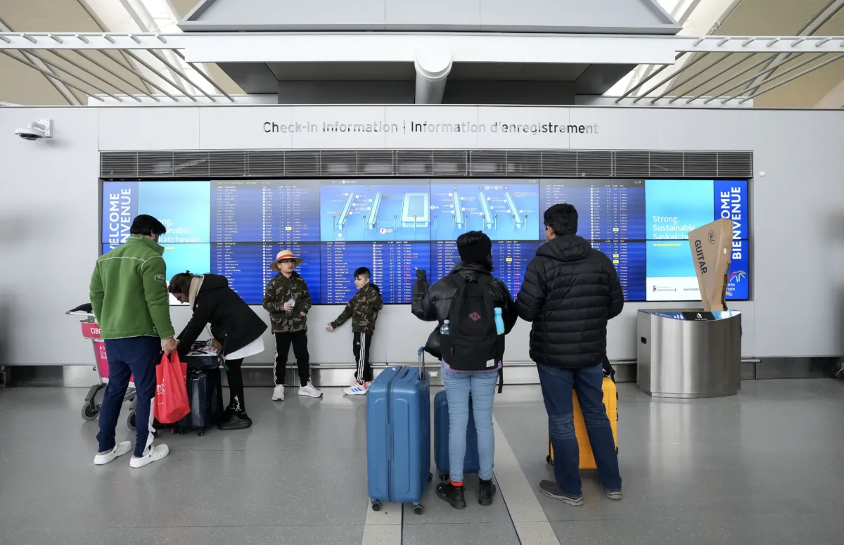 People are seen at Pearson International Airport in Toronto in a file photo. (The Canadian Press/Nathan Denette)
