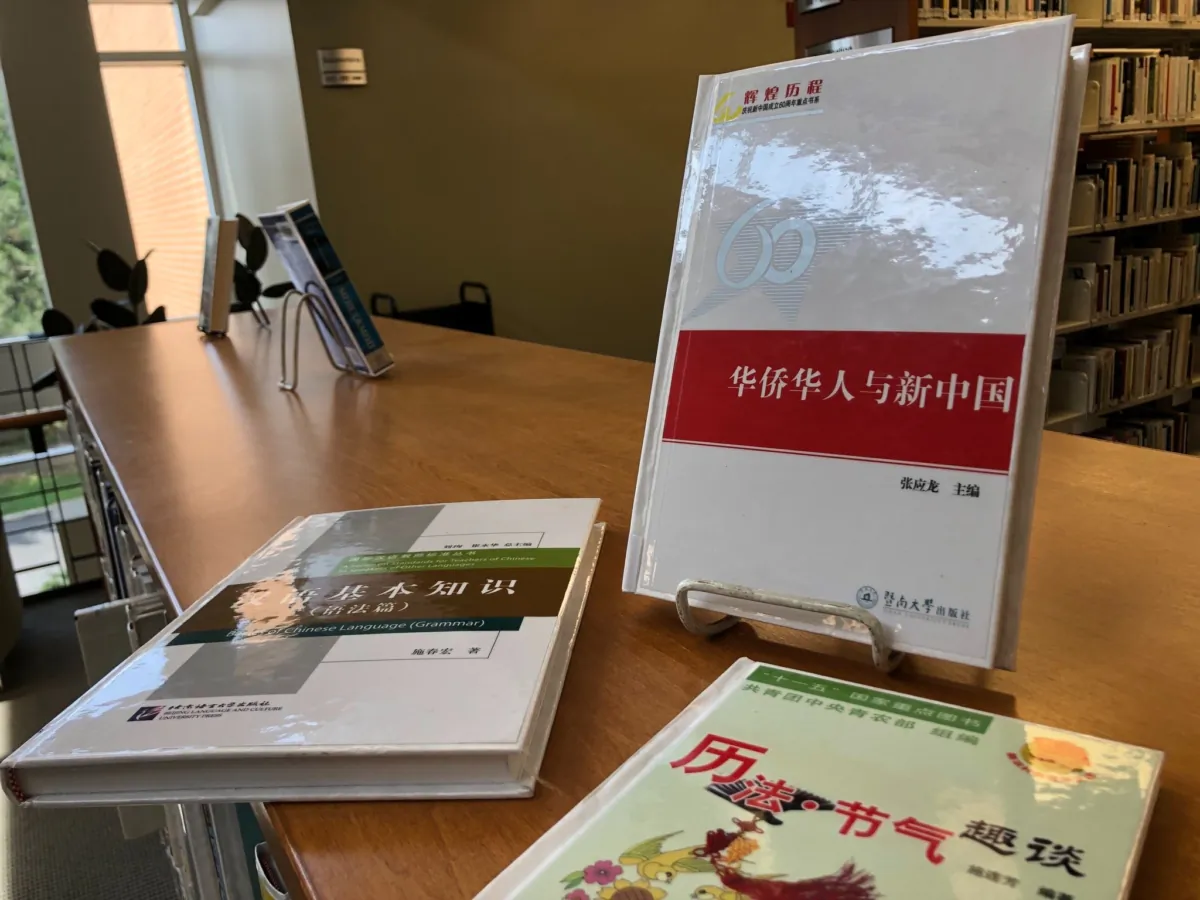 Books donated by the Chinese regime to the Brossard municipal library in 2017 are shown on July 12, 2023. (Noé Chartier/The Epoch Times)