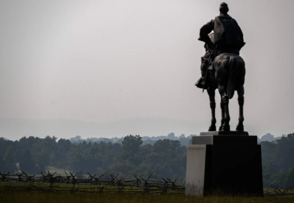 A statue of Andrew Jackson is seen at the Manassas National Battlefield Park as hills in the background are obscured by smoke from wildfires in Canada causing hazy conditions in Manassas, Va., on June 7, 2023. (Andrew Caballero-Reynolds/AFP via Getty Images)
