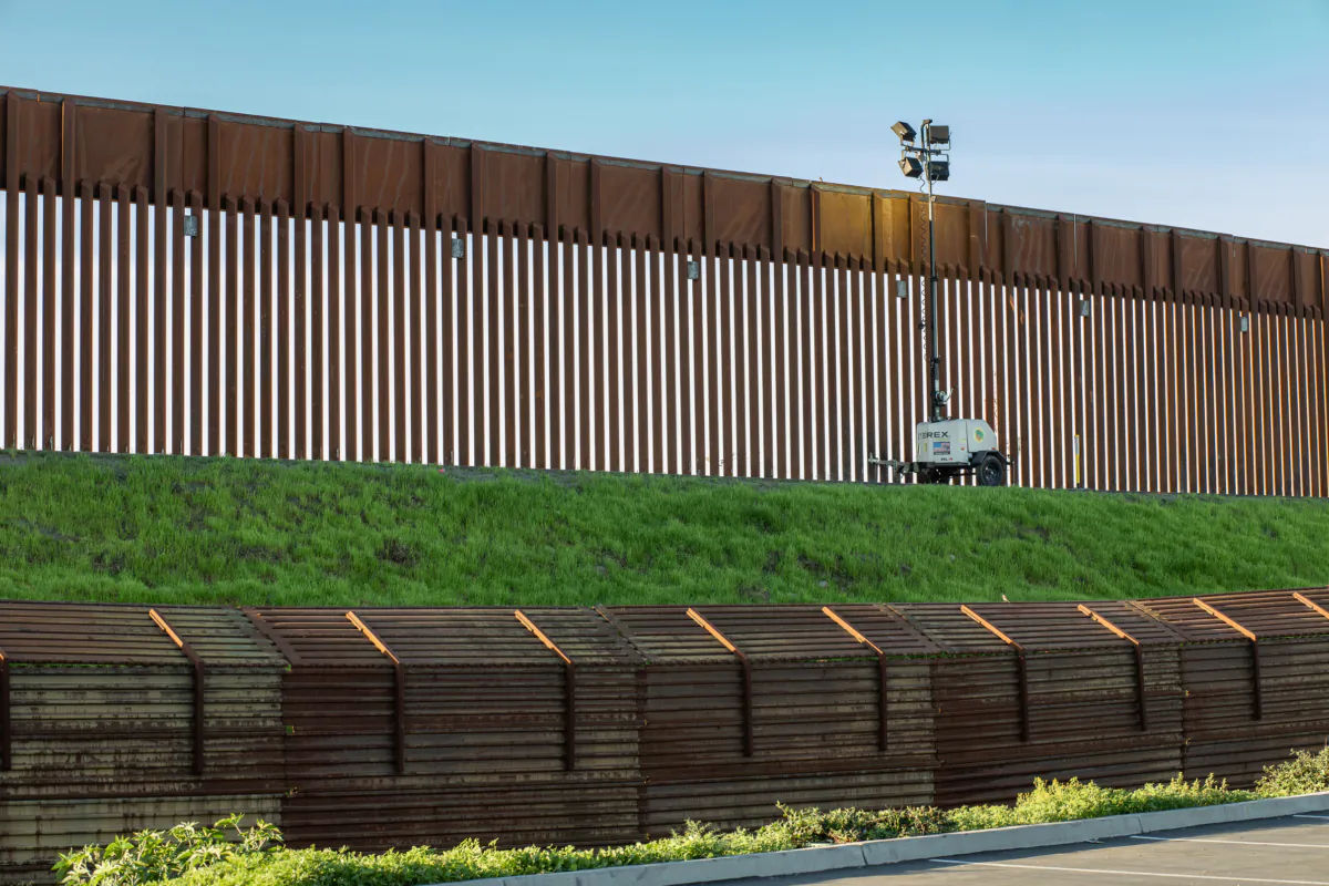 The US-Mexico Border Wall is seen from a shopping center in San Ysidro, Calif., on May 28, 2019. (John Fredricks/The Epoch Times)