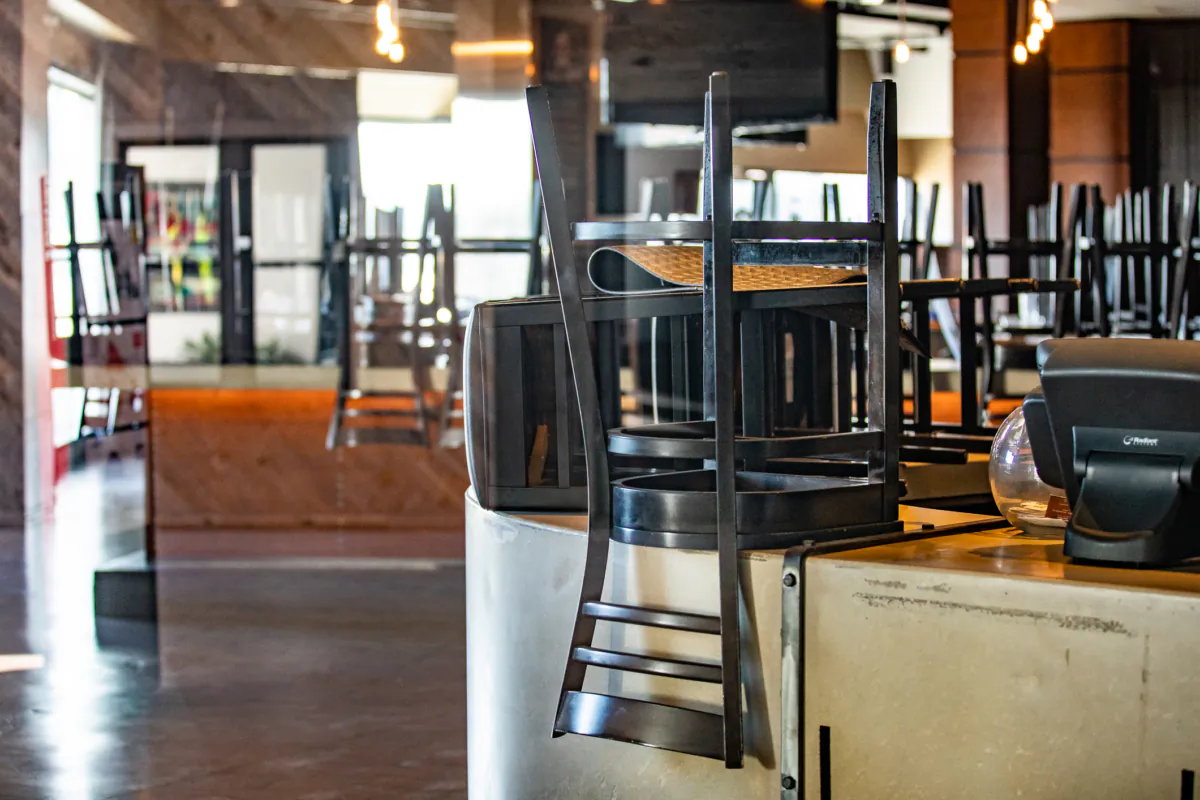 Stacked chairs in a restaurant in Costa Mesa, Calif., on Dec. 9, 2020. (John Fredricks/The Epoch Times)