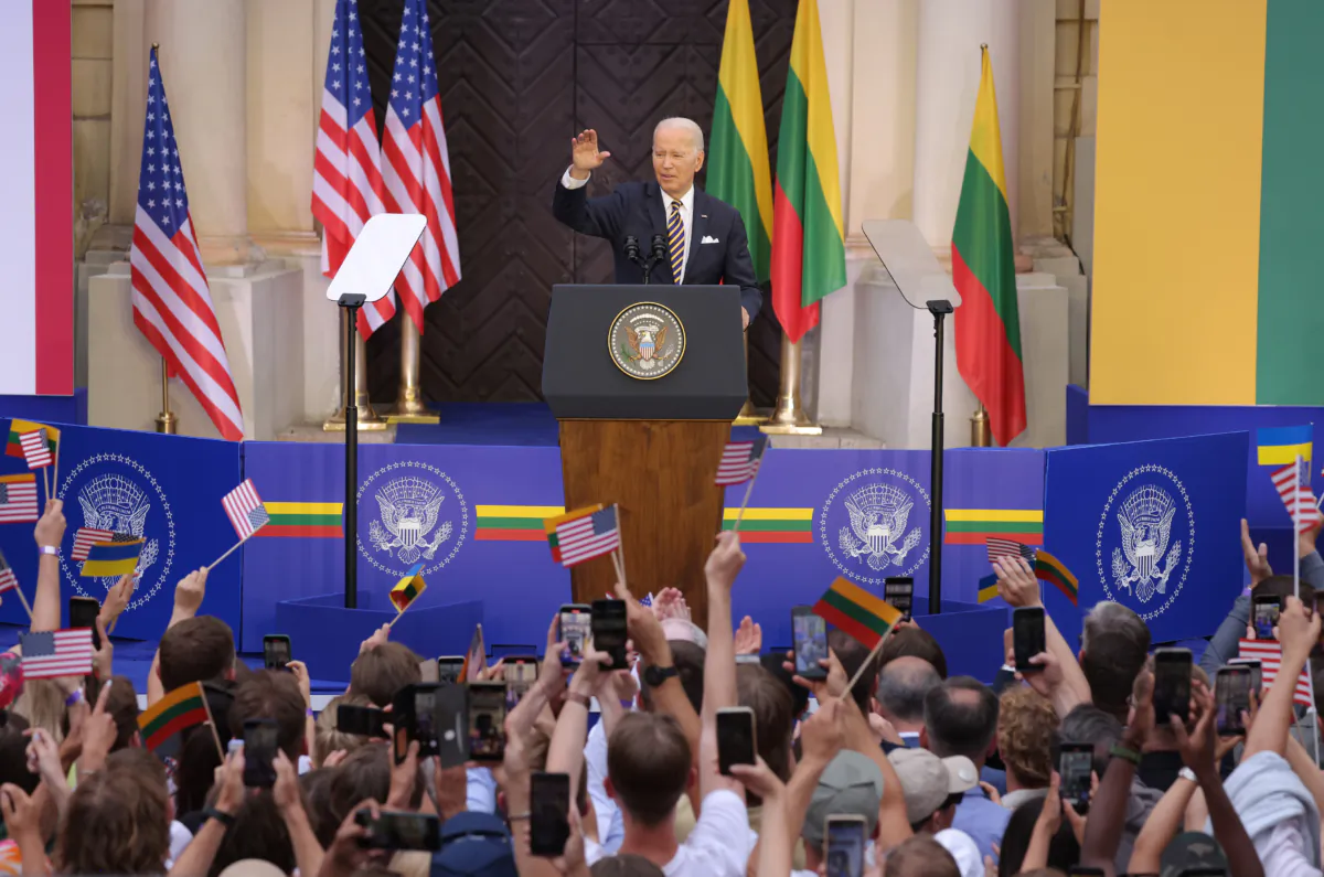 President Joe Biden waves to the crowd after he spoke at Vilnius University on July 12, 2023 in Vilnius, Lithuania. (Sean Gallup/Getty Images)