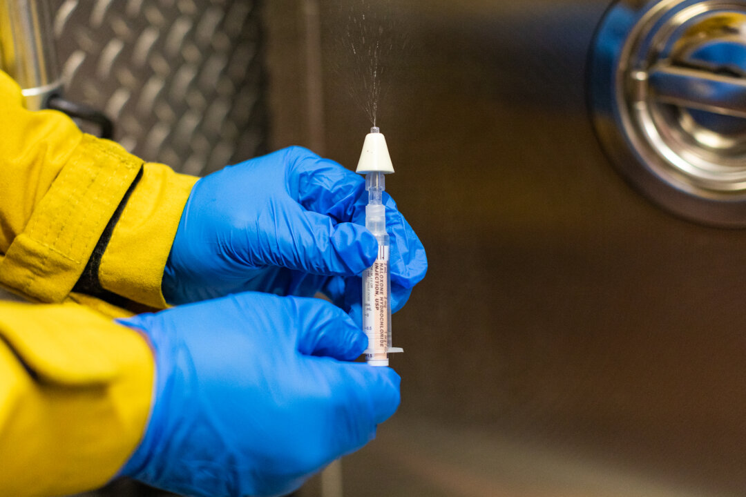 A firefighter displays Narcan, a lifesaving medicine used to treat drug overdoses, on Feb, 26, 2021. (John Fredricks/The Epoch Times)