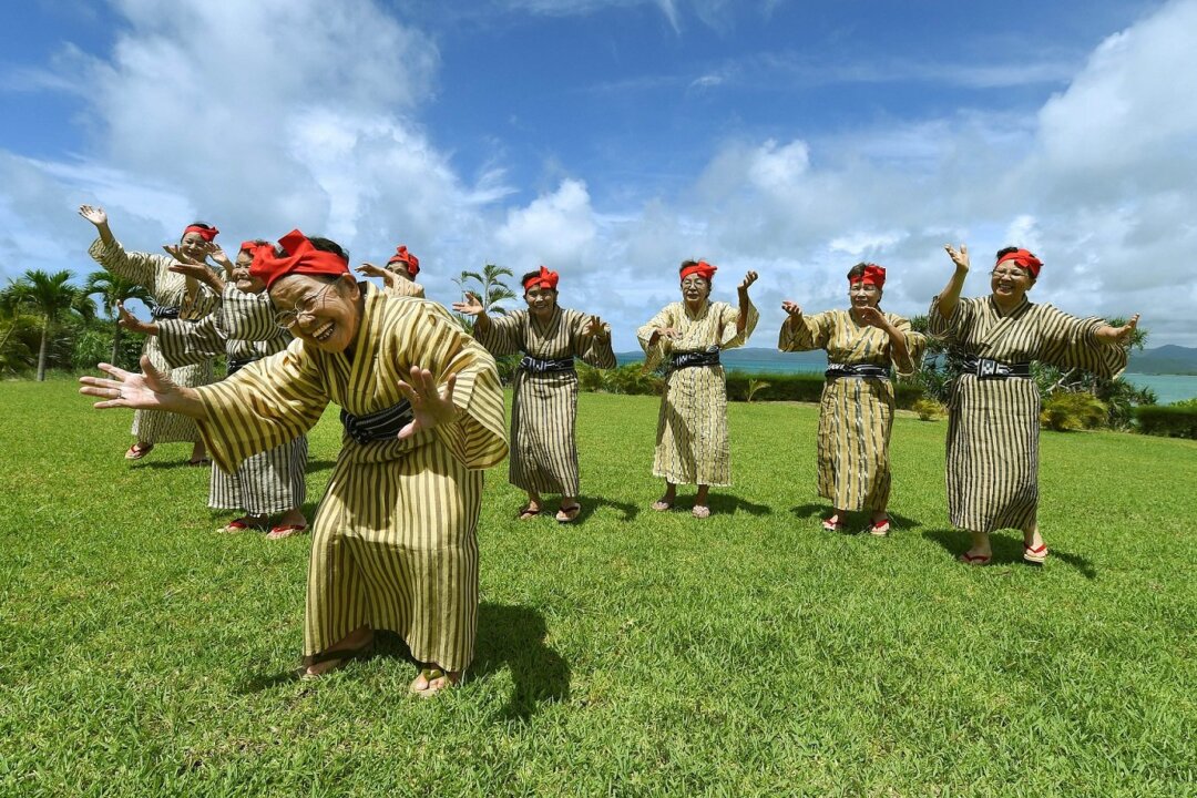 KGB84 is a girl band from Okinawa, consisting of elderly members with an average age of 84. They are often referred to as the "Idols Closest to Heaven." Photo taken on June 22, 2015. (Toru Yamanaka/AFP)
