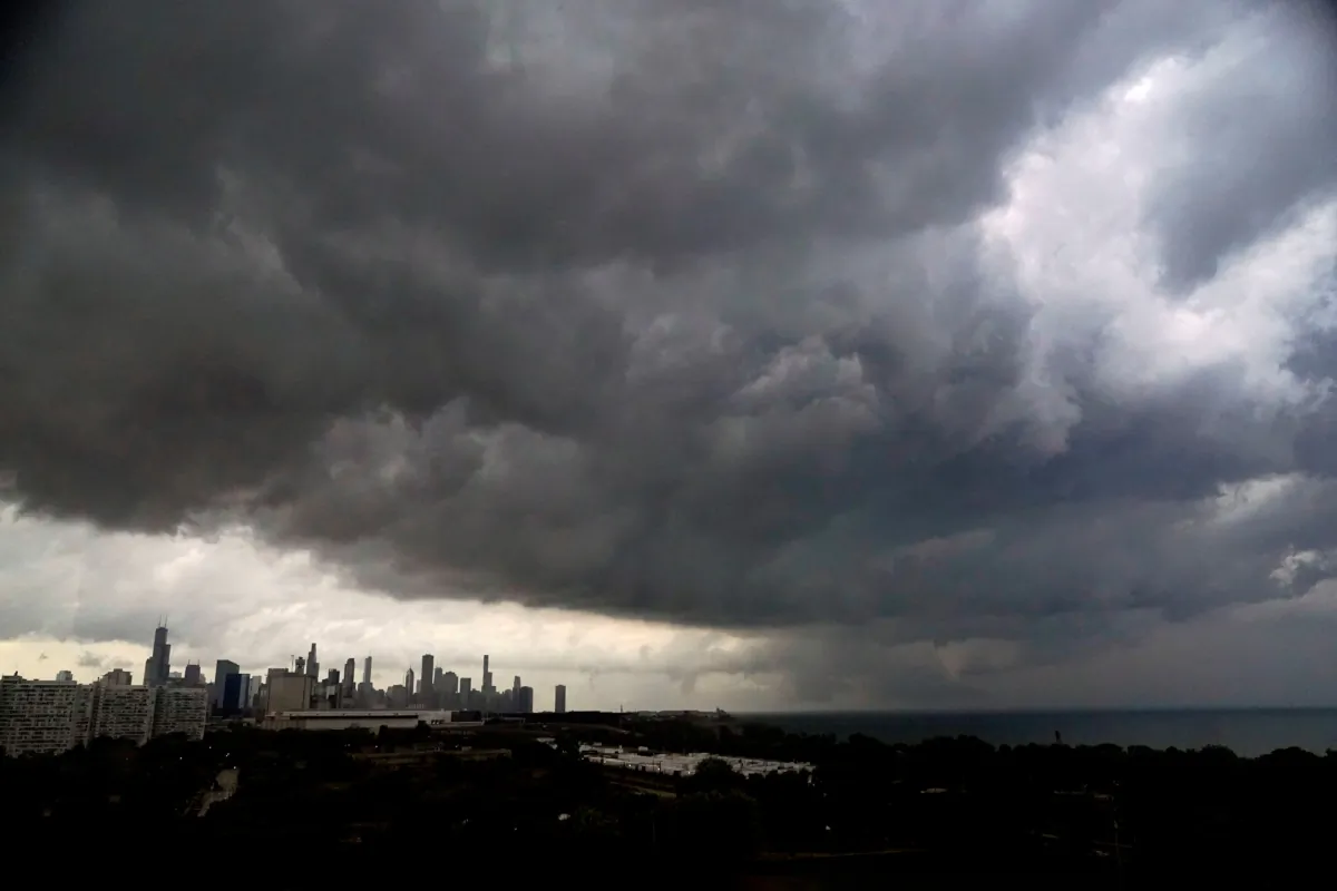 Storm clouds pass over downtown Chicago and the Bronzeville neighborhood of the city heading East out over Lake Michigan on July 12, 2023. (Charles Rex Arbogast/AP Photo)