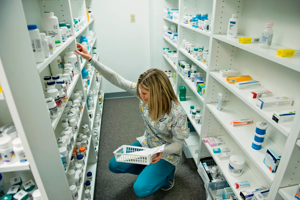 A staff member sorts through drugs while filling a prescription at the Clay-Battelle Community Health Center's pharmacy in Blacksville, W. Va., on March 21, 2017. (Brendan Smialowski/AFP via Getty Images)