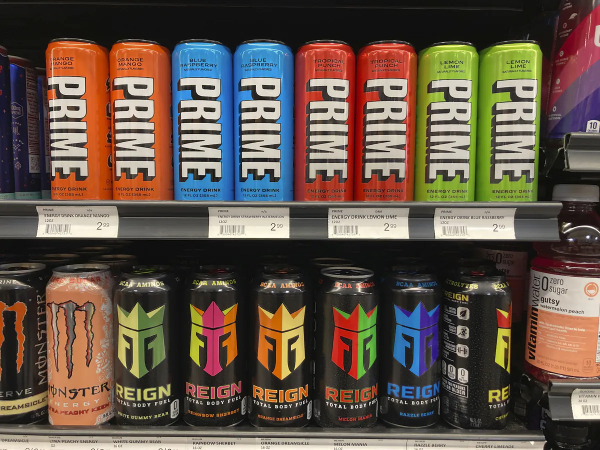 Prime energy drinks are displayed with other energy drinks at a grocery store in Detroit, March 24, 2023. (AP Photo/Carlos Osorio)