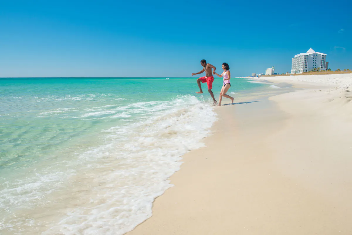 Vacationers enjoy a dip at Pensacola Beach in Pensacola, Florida. (Duncan McCall/Courtesy of Visit Pensacola/TNS)