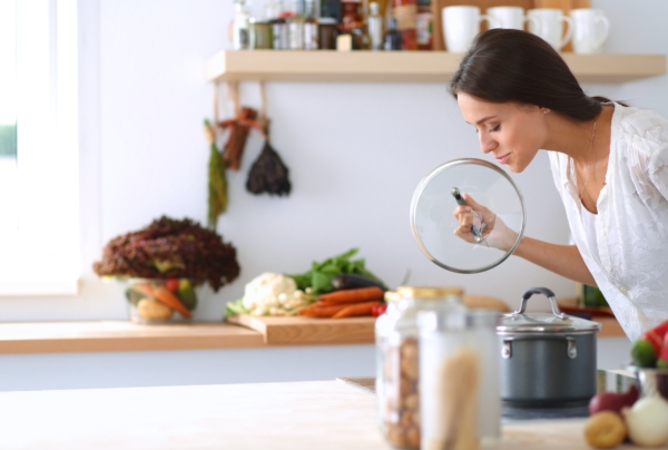 woman cooking something aromatic