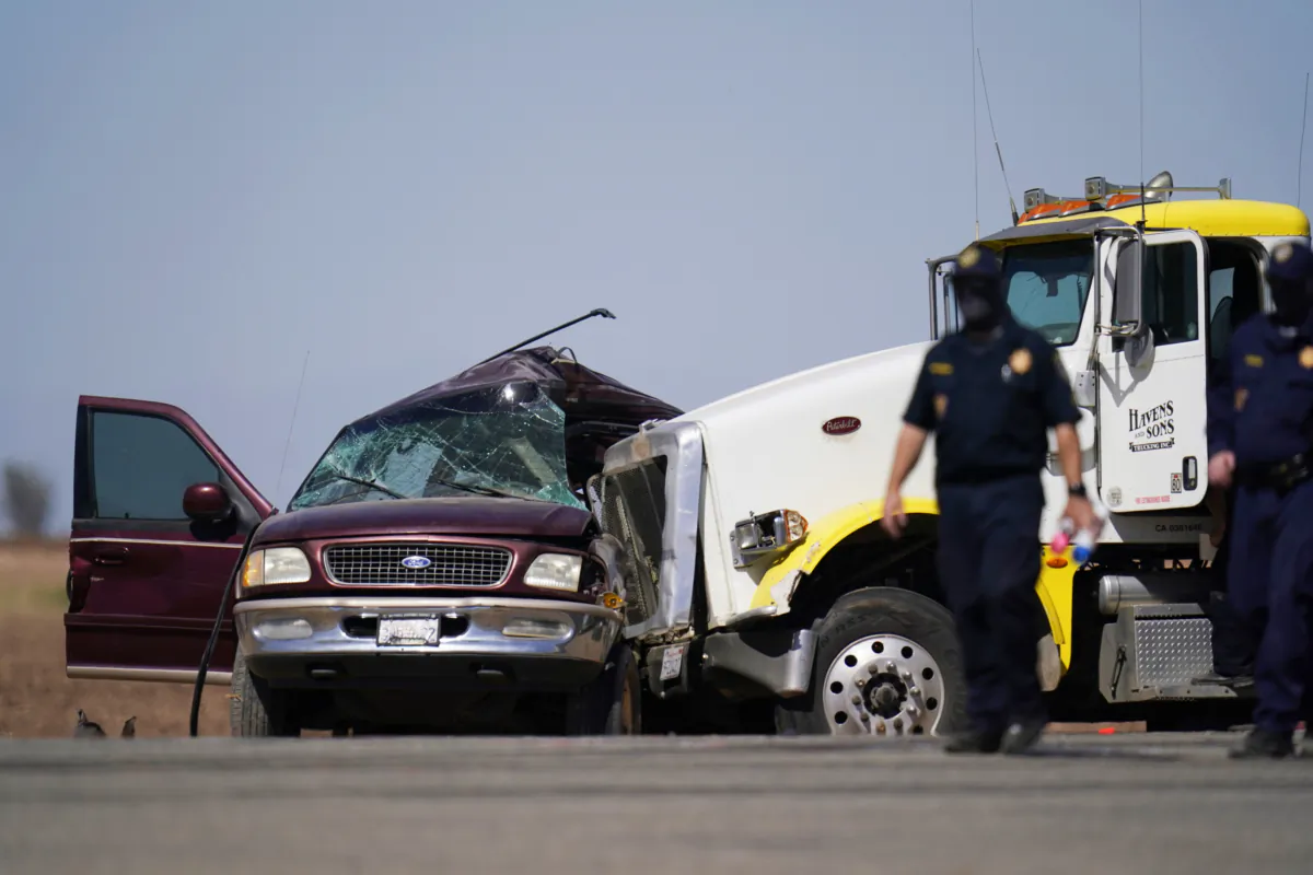 Law enforcement officers work at the scene of a deadly crash in Holtville, Calif., on March 2, 2021. (Gregory Bull/AP Photo)