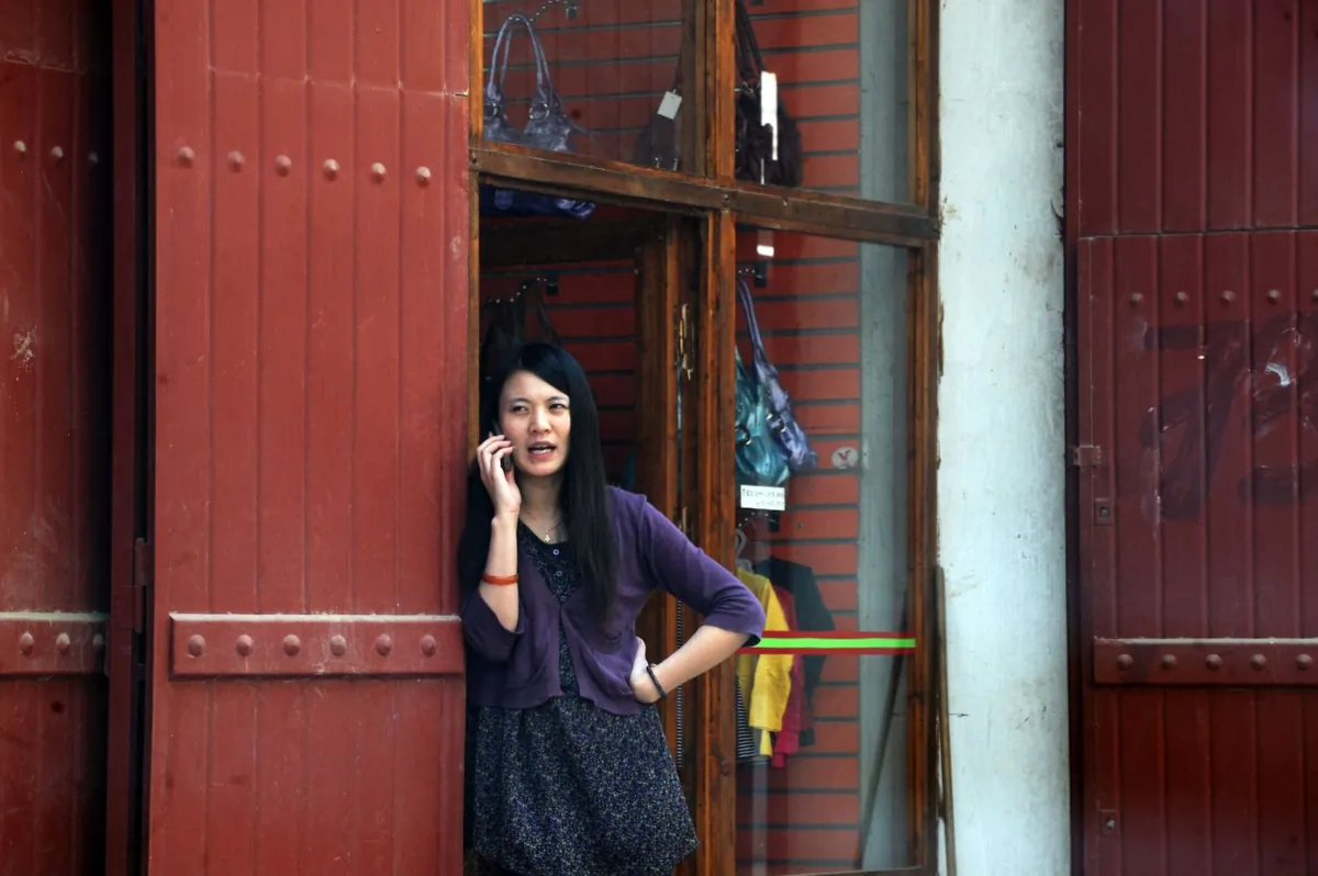 A file image of a Chinese woman talking on a mobile phone in Bab Ezouar, a suburb of Algiers on Nov. 3, 2009. (Fayez Nureldine/AFP via Getty Images)