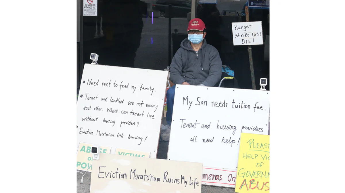 George Wu protests the Oakland Eviction Moratorium. (Epoch Times Staff Photo)