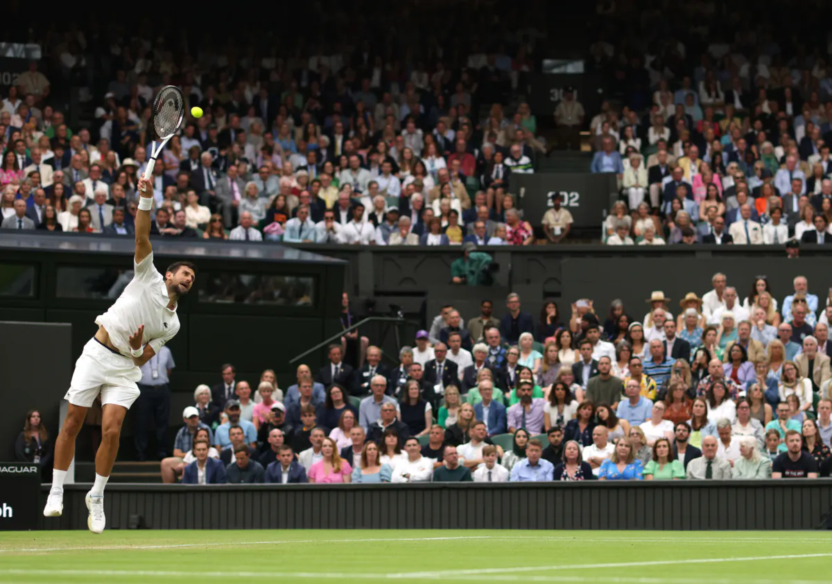 Novak Djokovic of Serbia serves against Jannik Sinner of Italy in the Men's Singles Semi Finals on day twelve of The Championships Wimbledon 2023 at All England Lawn Tennis and Croquet Club in London, England, on July 14, 2023. (Julian Finney/Getty Images)