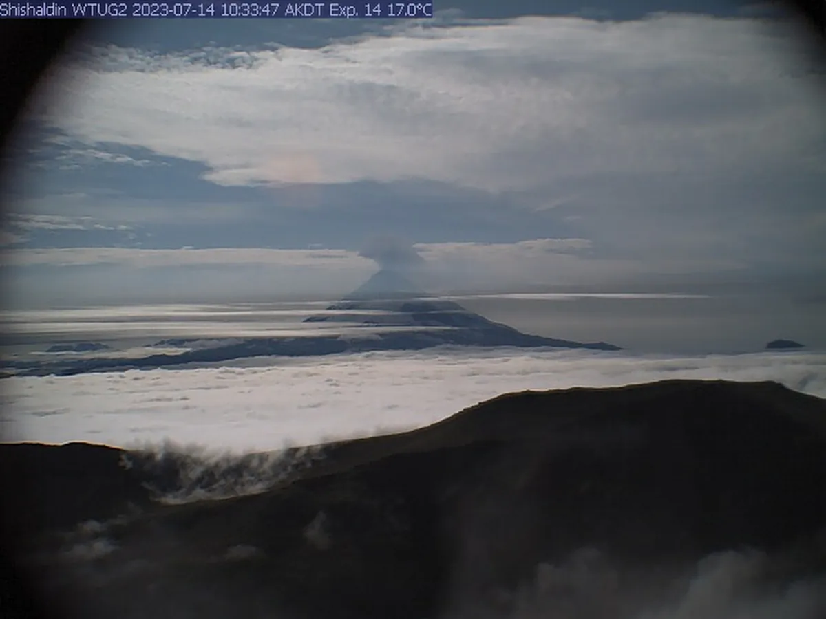 A low-level ash plume from the Shishaldin Volcano captured in an Alaska Volcano Observatory webcam located NW of Mt. Shishaldin in Alaska at 10:33 a.m. AKDT on July 14, 2023. (Matt Loewen/Alaska Volcano Observatory/U.S. Geological Survey via AP)