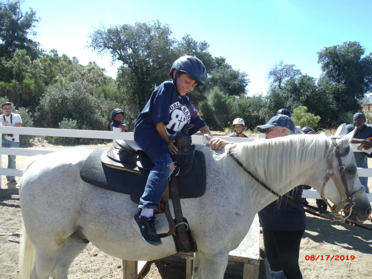 A boy participates in the boys' camp at the Double R Ranch operated by the Christian-based nonprofit Orange County Rescue Mission, in San Diego County, Calif. (Courtesy of Orange County Rescue Mission)