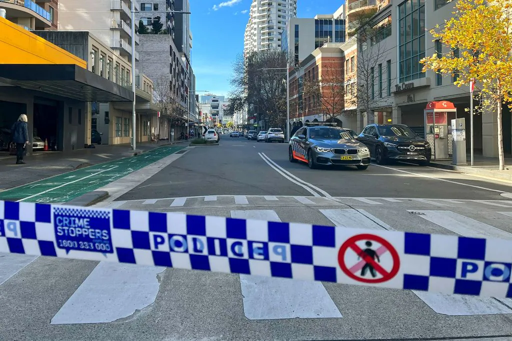Police block off a street at Bondi Junction, an eastern suburb of Sydney on June 27, 2023 after a shooting incident. Australian police said a man was killed in Sydney's famed Bondi neighbourhood on June 27, in what local media called a "gang hit". (Photo by Andrew LEESON / AFP) (Photo by ANDREW LEESON/AFP via Getty Images)
